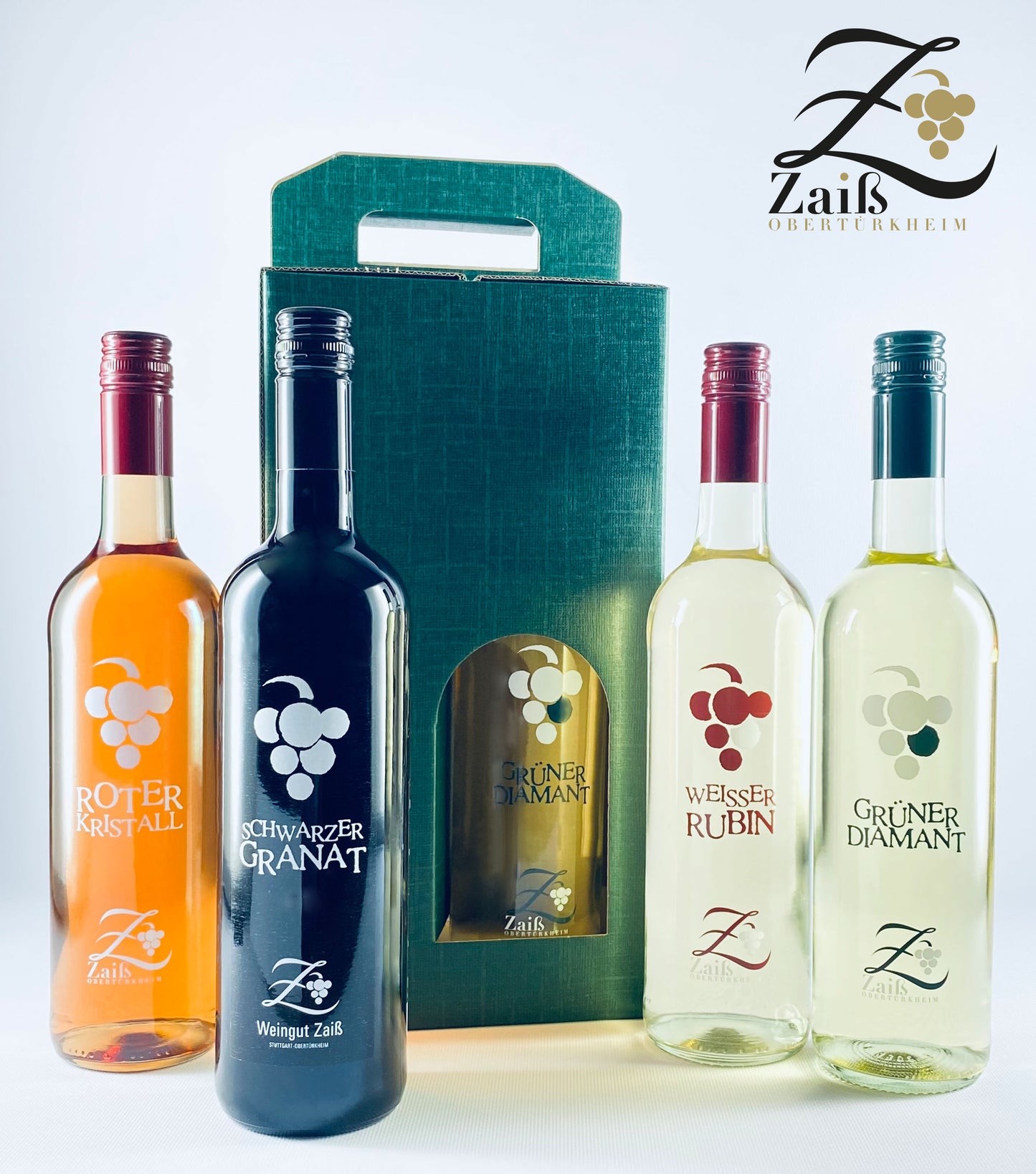 Edelsteinlinie Geschenk-Päckle: Bestehend aus Roter Kristall, Schwarzer Granat, Weisser Rubin, Grüner Diamant und einem Geschenkkarton